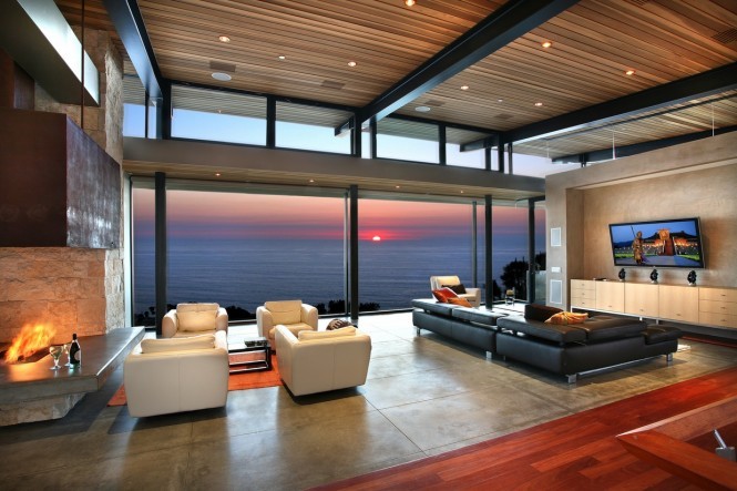 Panoramic-ocean-view-in-modern-living-room-with-big-screen-TV
