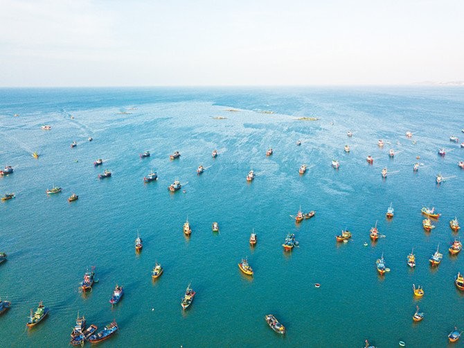 This photo shows many fishing boats fishing in the same area which leads to overfishing. https://www.worldwildlife.org/threats/overfishing